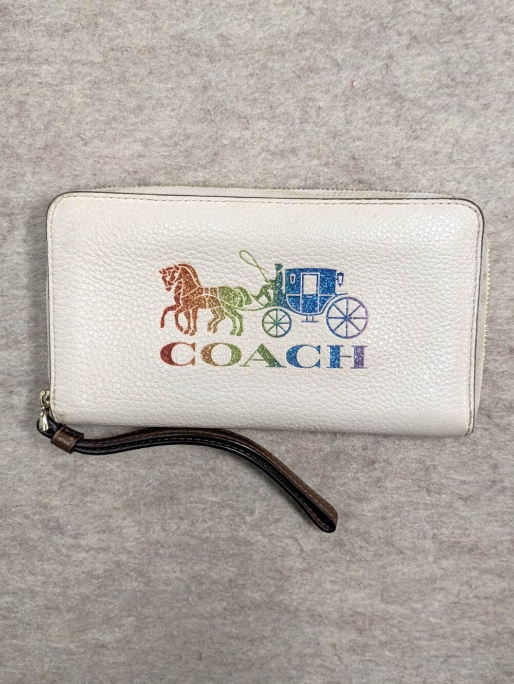 Like New COACH Wristlet Wallet Rainbow Glitter Stagecoach Logo Cream Leather